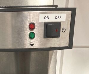 2. Turn on the coffemaker. If water has already been added, it will start running through.